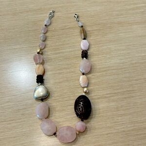 Retired Silpada Rose Quartz necklace that highlights Sterling and Brazilian wood
